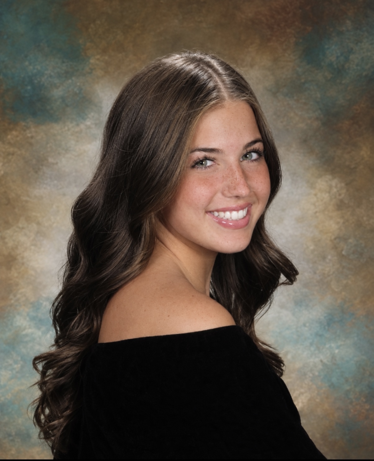 Senior portrait of Tatum in a black off-the-shoulder gown